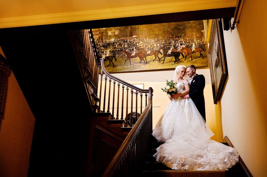 Wedding couple walking down stairs