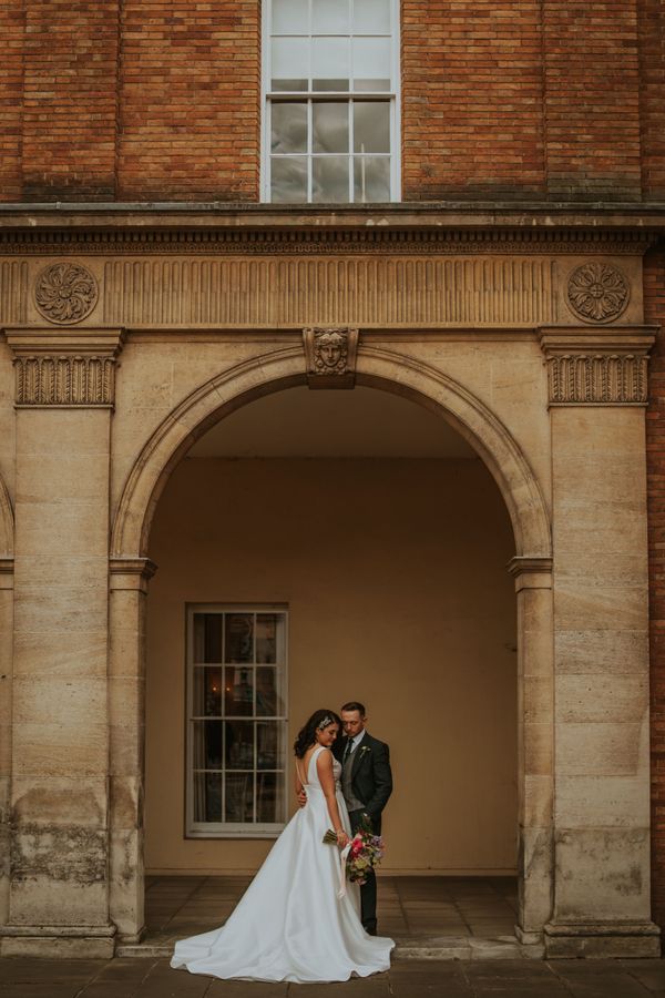Wedding couple in front of building